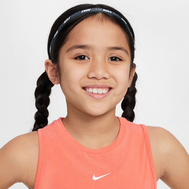 Youth coral pink tank close-up with Nike swoosh on chest