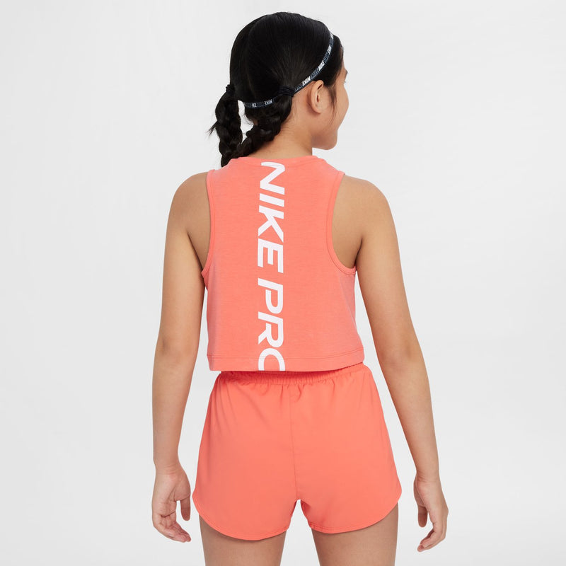Youth coral pink Nike Pro tank back view with vertical “NIKE PRO” lettering