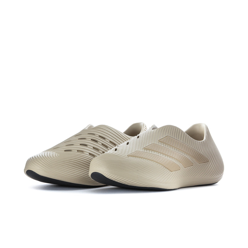 Pair of men's khaki slip-on sneakers, side view with stitched branding detail