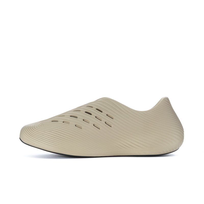 Men's khaki slip-on sneakers, side profile with perforated toe and panel stripes