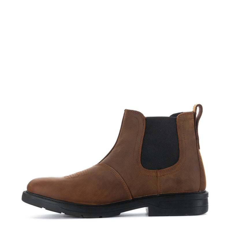 Brown Chelsea ankle boot with elastic gore panels and black outsole
