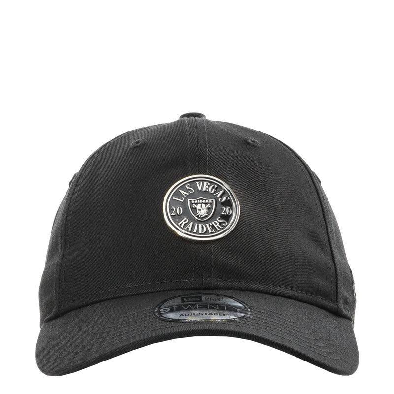 Black baseball cap with circular Raiders logo patch on the front, curved brim