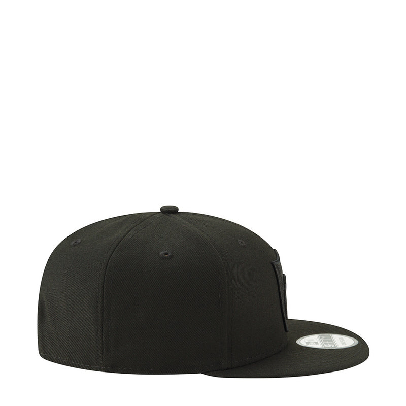 Black baseball cap side profile with curved brim and small side logo patch