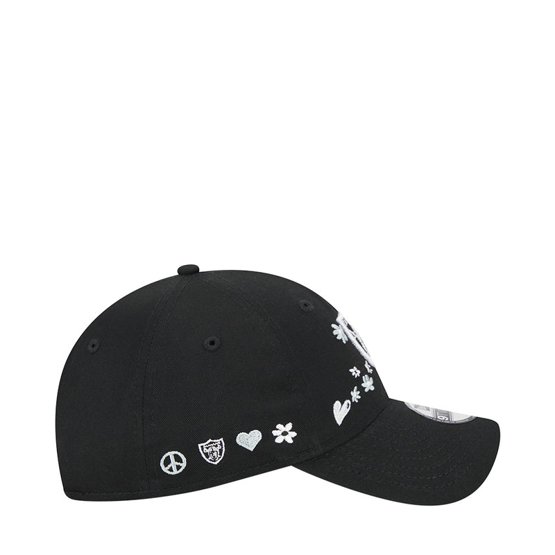 Kids' black baseball cap with scattered white peace, heart, and flower icons