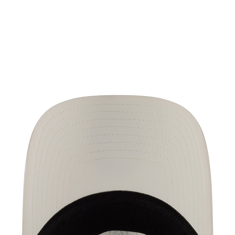 White strapback cap back panel with curved seam stitching and ventilation eyelets