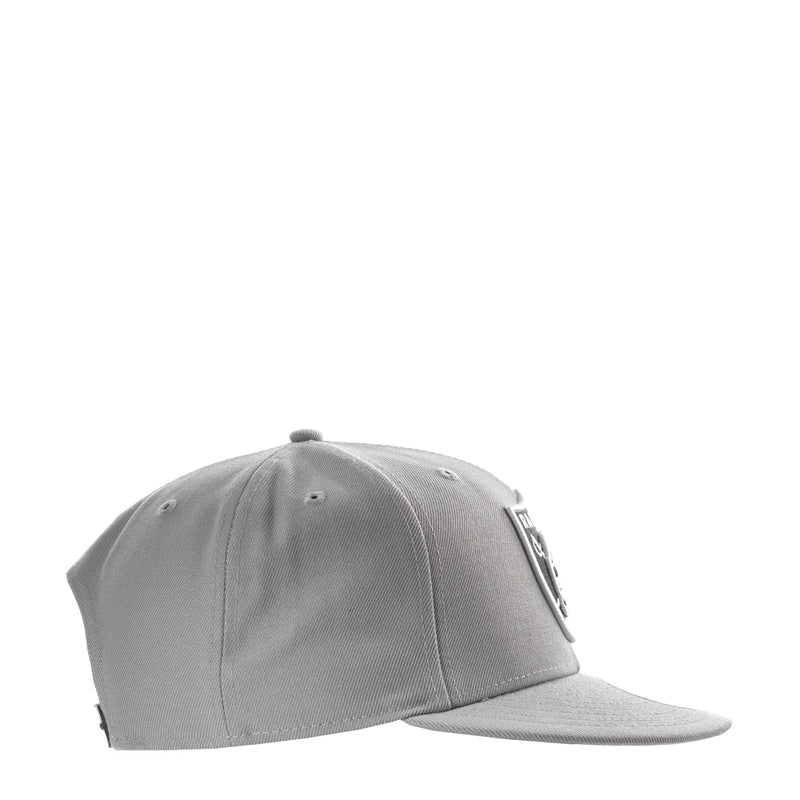 Grey baseball cap viewed from the side with a New Era flag patch