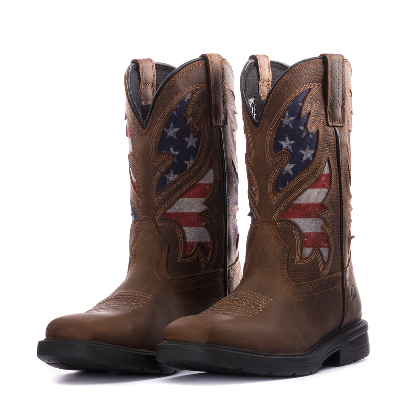 Pair of men's brown cowboy boots with American flag embroidery, side view