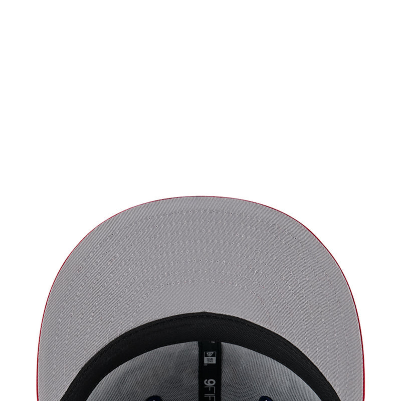 Two-tone cap interior lining in gray with black trim and small size label.