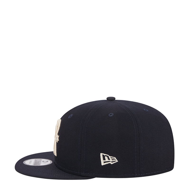 Navy junior baseball cap with New Era flag logo centered on front panel