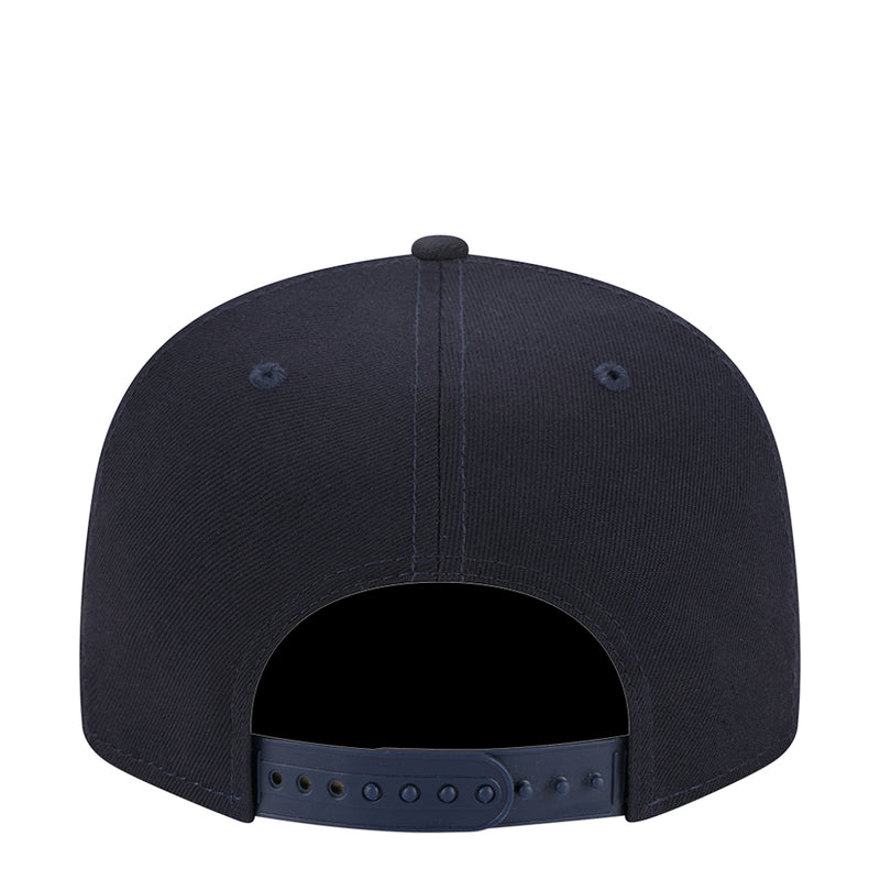 Navy junior baseball cap back view with adjustable strap and eyelets
