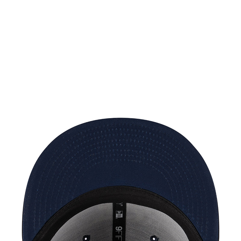 Navy junior baseball cap crown with textured pattern and inner New Era label