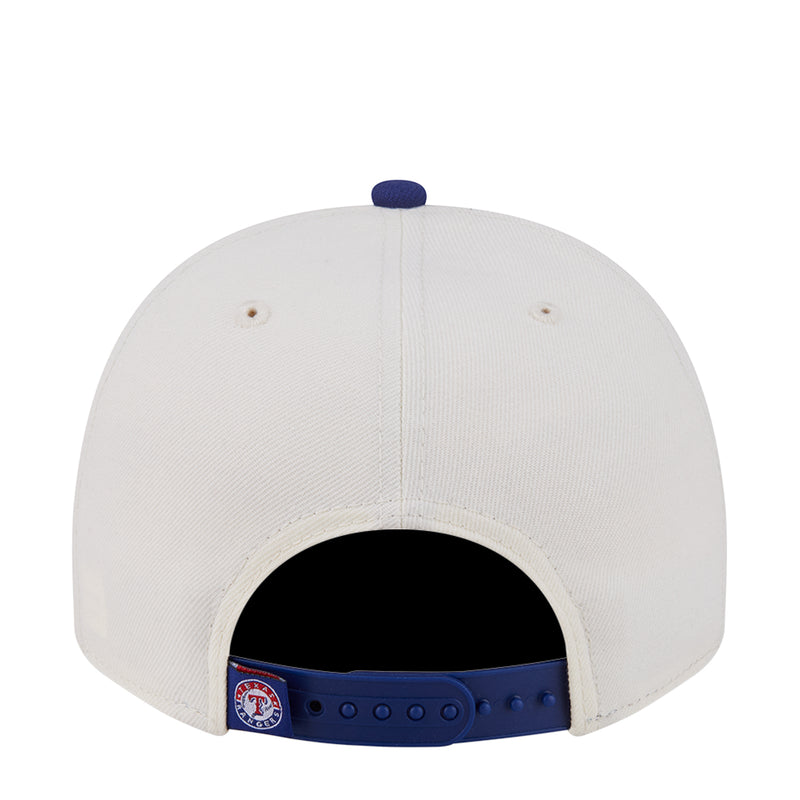 Two-tone A-frame cap with cream crown and navy inner band at the back opening