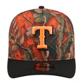Two-tone A-frame camo baseball cap with orange tree-leaf pattern and black front