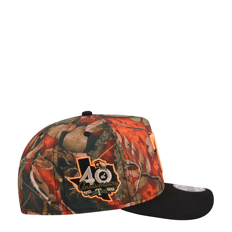 A-frame camo baseball cap with orange/green tree pattern, black brim, front logo patch