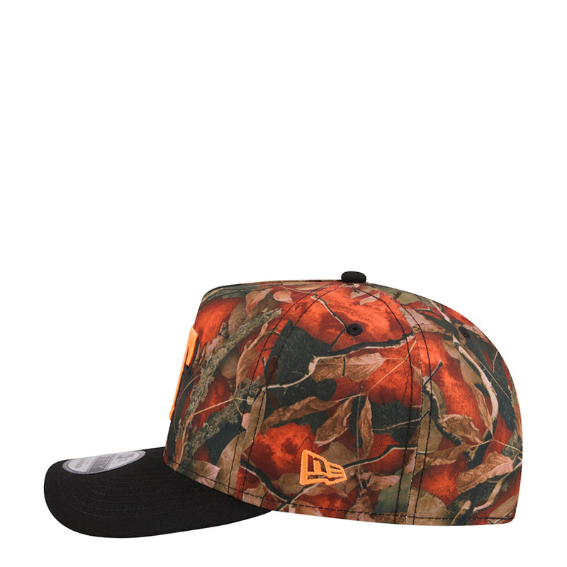 A-frame camo baseball cap with orange/green tree-leaf pattern, black brim and tan emblem