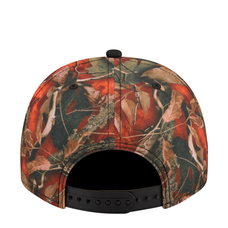 A-frame camo baseball cap back with orange/green tree-leaf pattern and adjustable strap