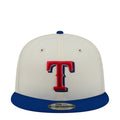 Two-tone baseball cap in light gray and blue, front red-and-blue T logo