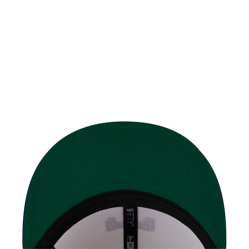 Two-tone baseball cap with green crown and dark inner brim