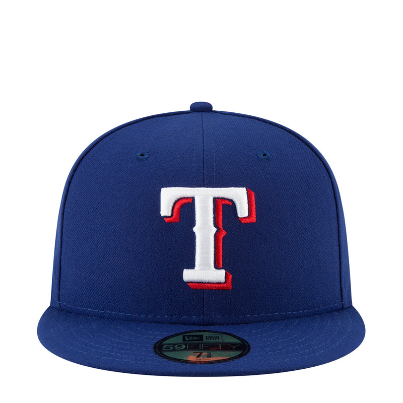 Royal blue baseball cap with white-and-red T team logo on front