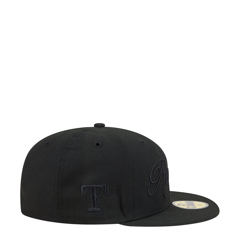 Black baseball cap with small side emblem and New Era flag patch on brim
