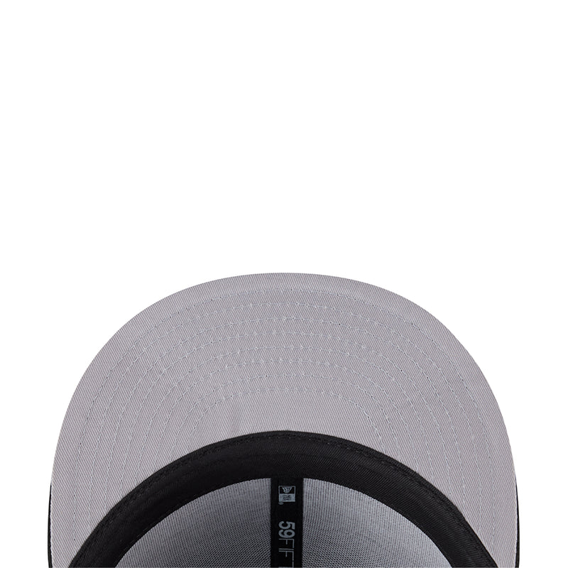 Light gray baseball cap brim close-up with black inner band label