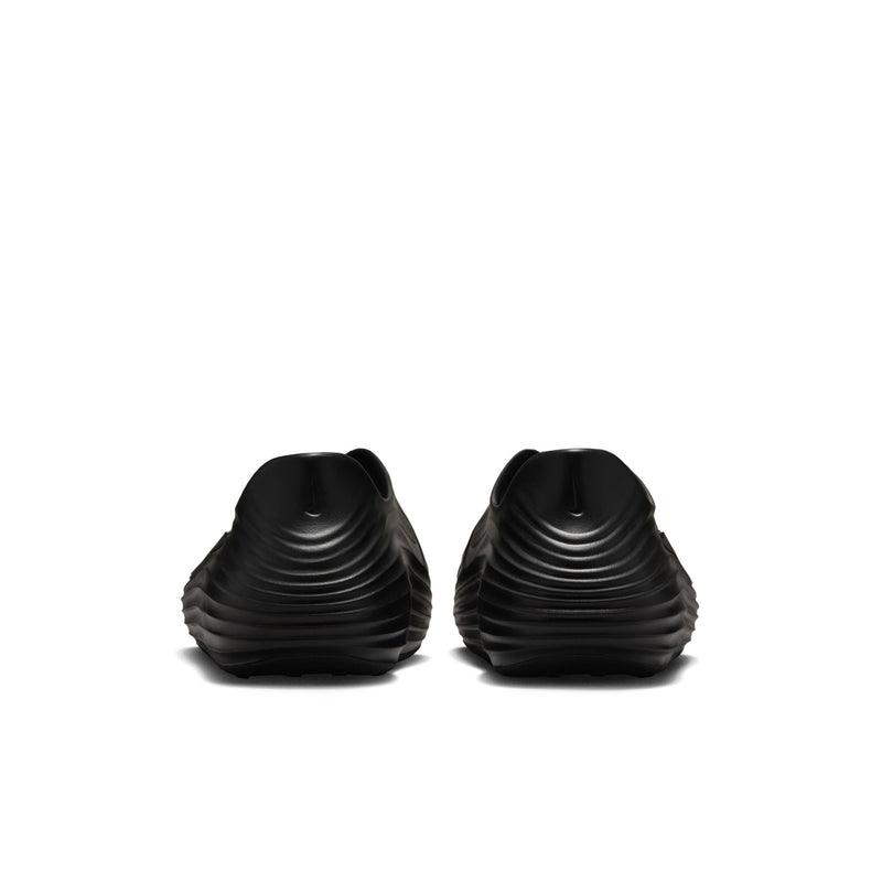 Pair of black slip-on clogs with ribbed sides and circular ventilation holes.