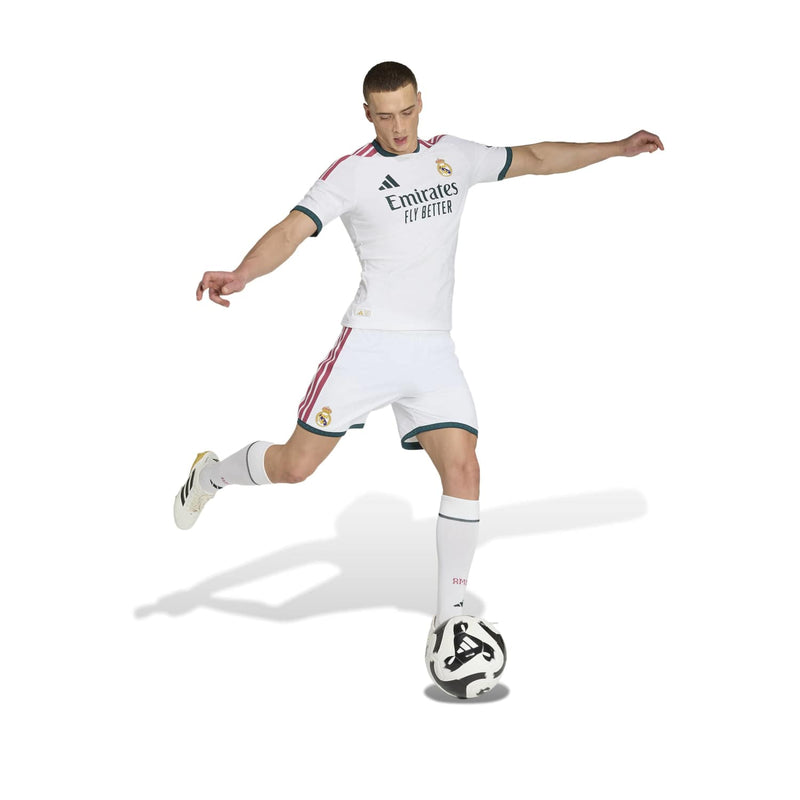 Men’s white home jersey in motion, showing teal trim and red side stripes