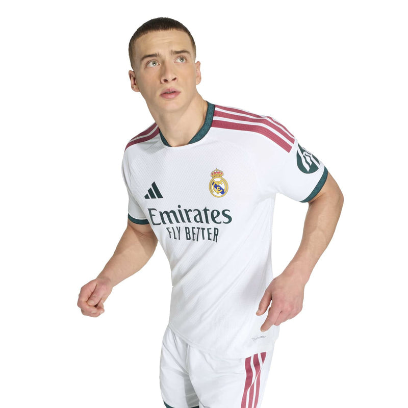 Men’s white home jersey close-up with Emirates Fly Better sponsor and teal collar trim