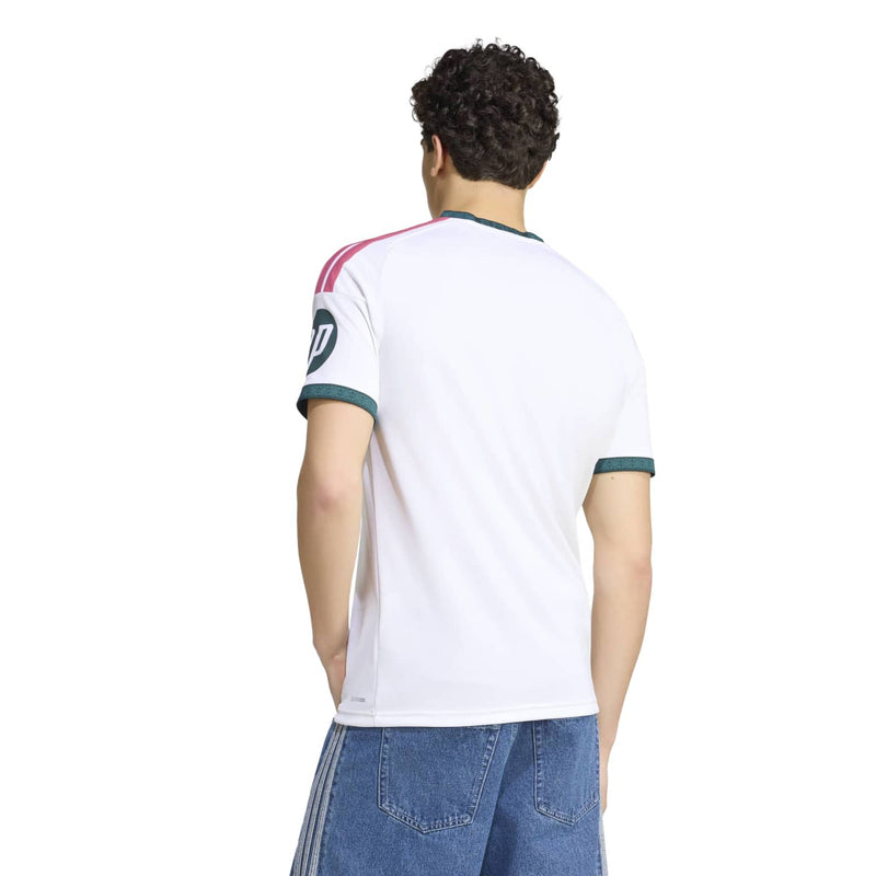 White Real Madrid home replica jersey back view with green cuffs and pink shoulder stripes