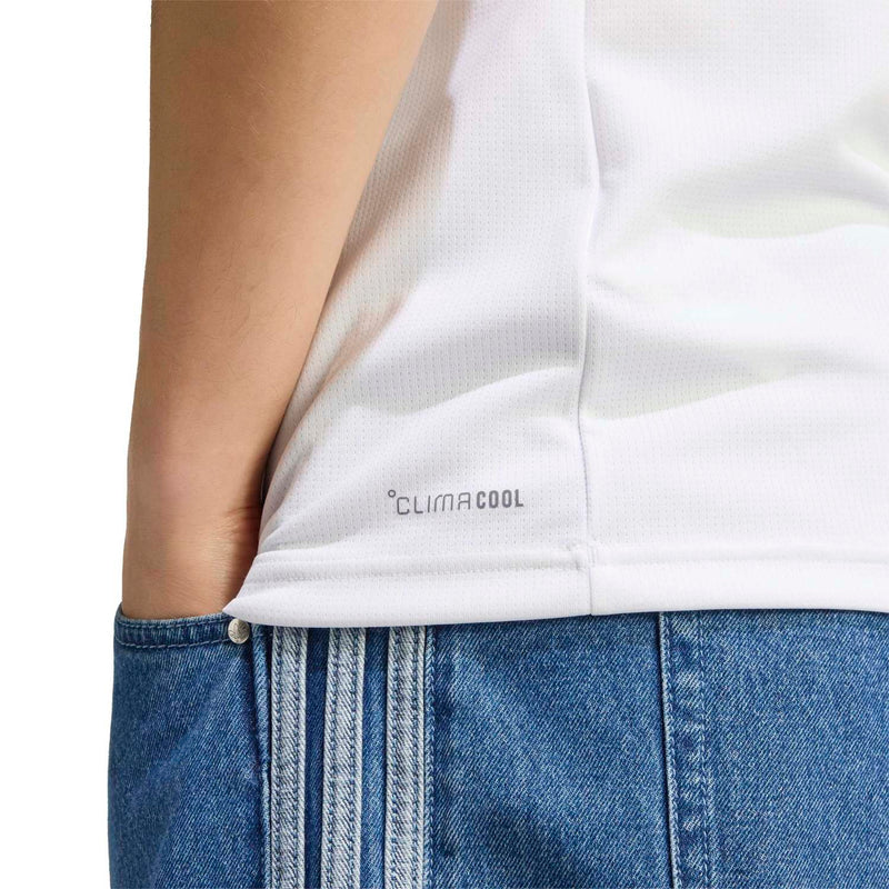 White jersey fabric close-up with 'climacool' text above blue denim shorts