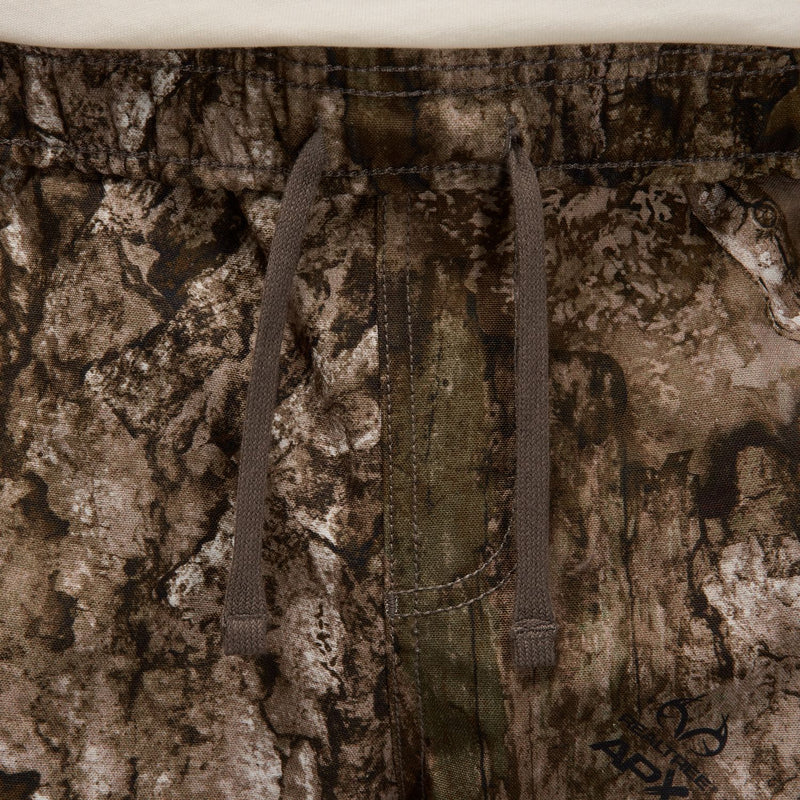 Camouflage woven pants showing elastic waistband and straight leg construction