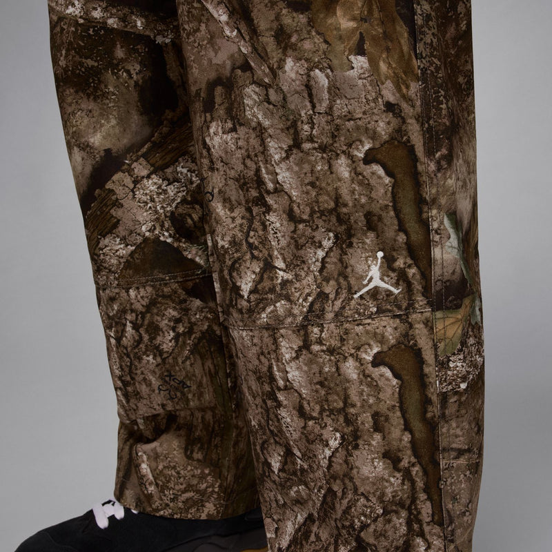 Camouflage woven pants with side pocket and small logo mark on the leg