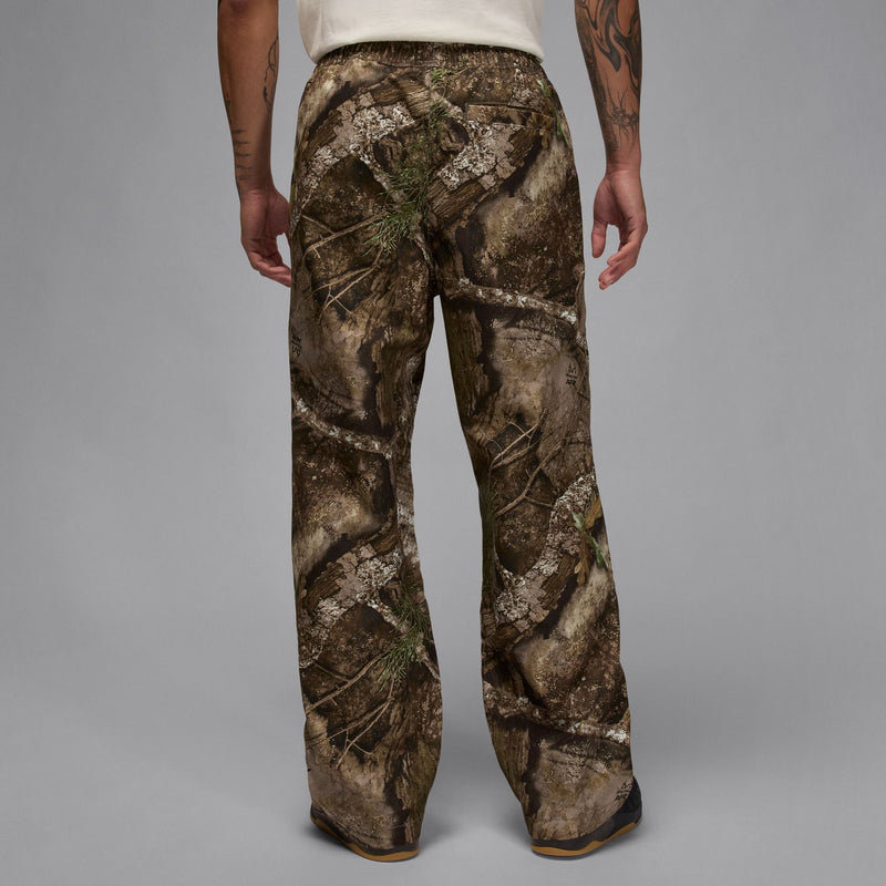 Men's camouflage woven pants viewed from behind, straight leg and elastic waist
