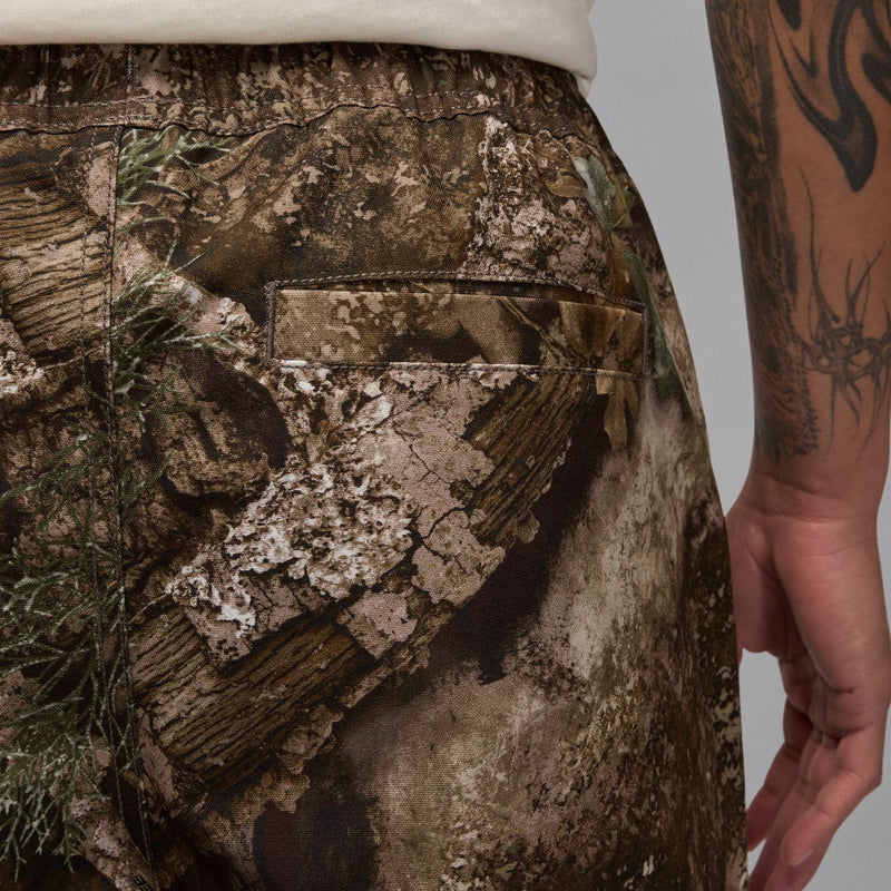 Camouflage woven pants with back pocket detail and stitched waistband