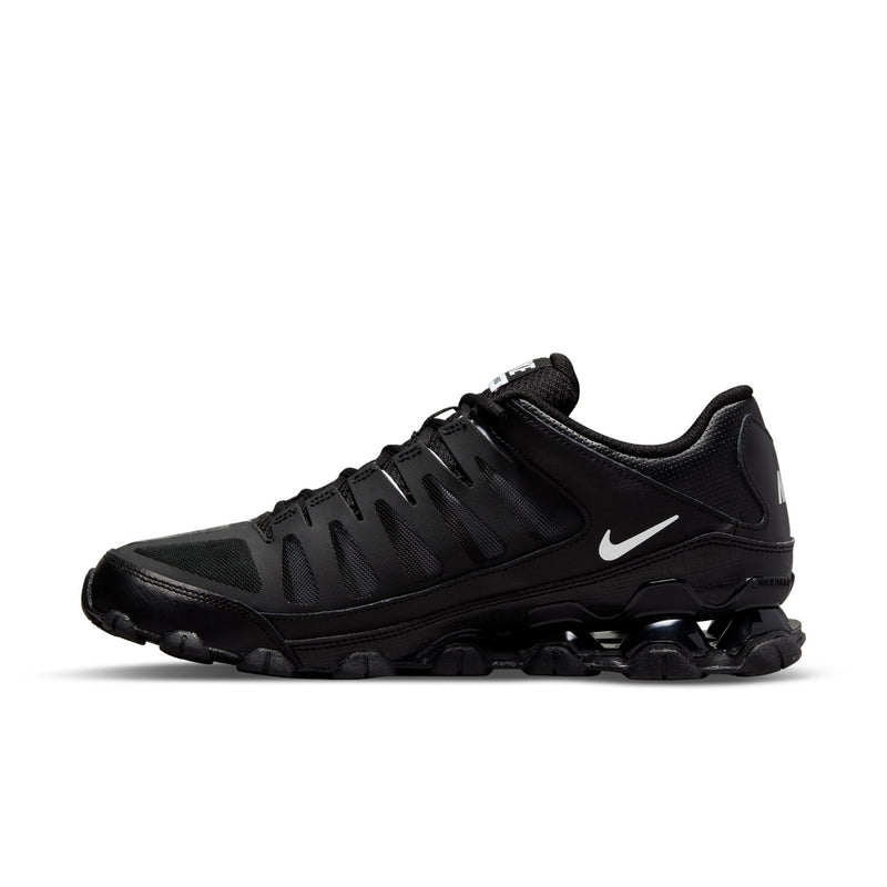Men's black Nike training shoe, side view with swoosh and rugged traction pods.
