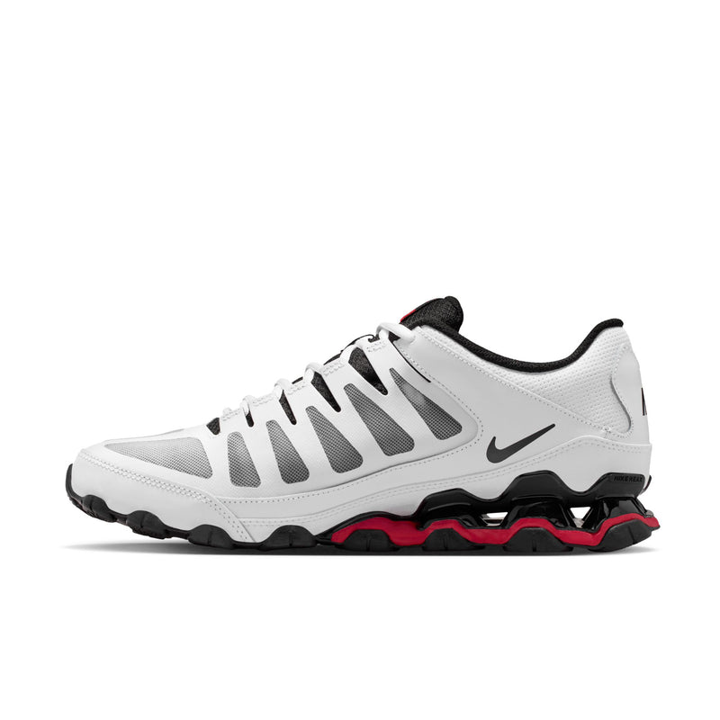 Men's white training shoes with black details, red outsole edge, and Nike swoosh