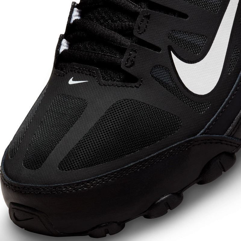 Men's black Nike training shoe close-up, perforated upper and white swoosh branding.