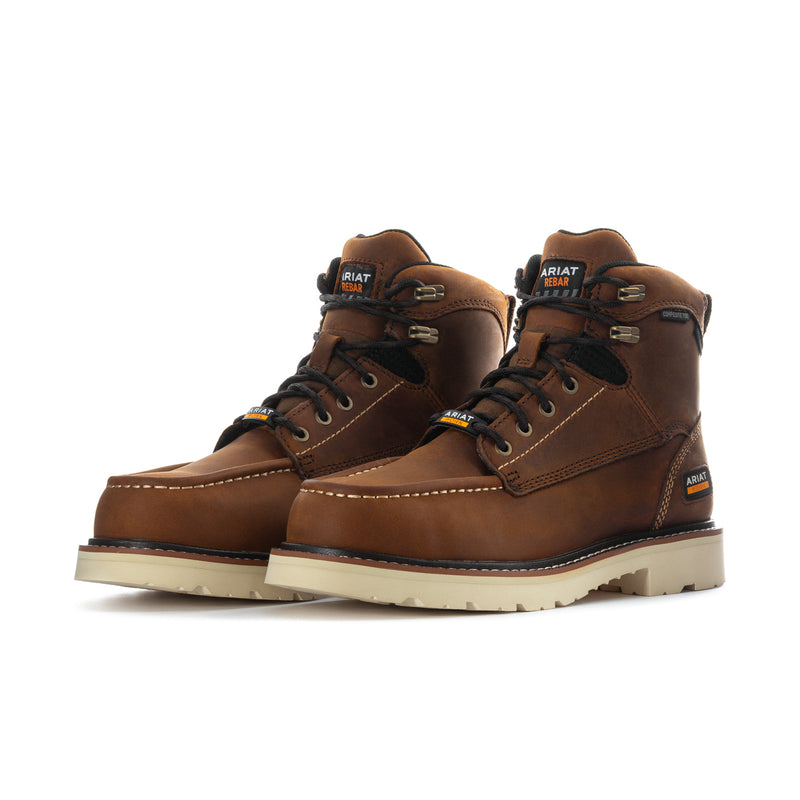 Pair of men's brown comp-toe work boots with laces, ankle support, and light tread sole.