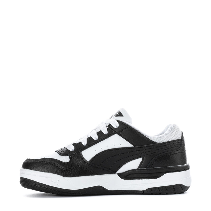 Kids low-top sneakers side view, black overlays and white midsole, lace-up design