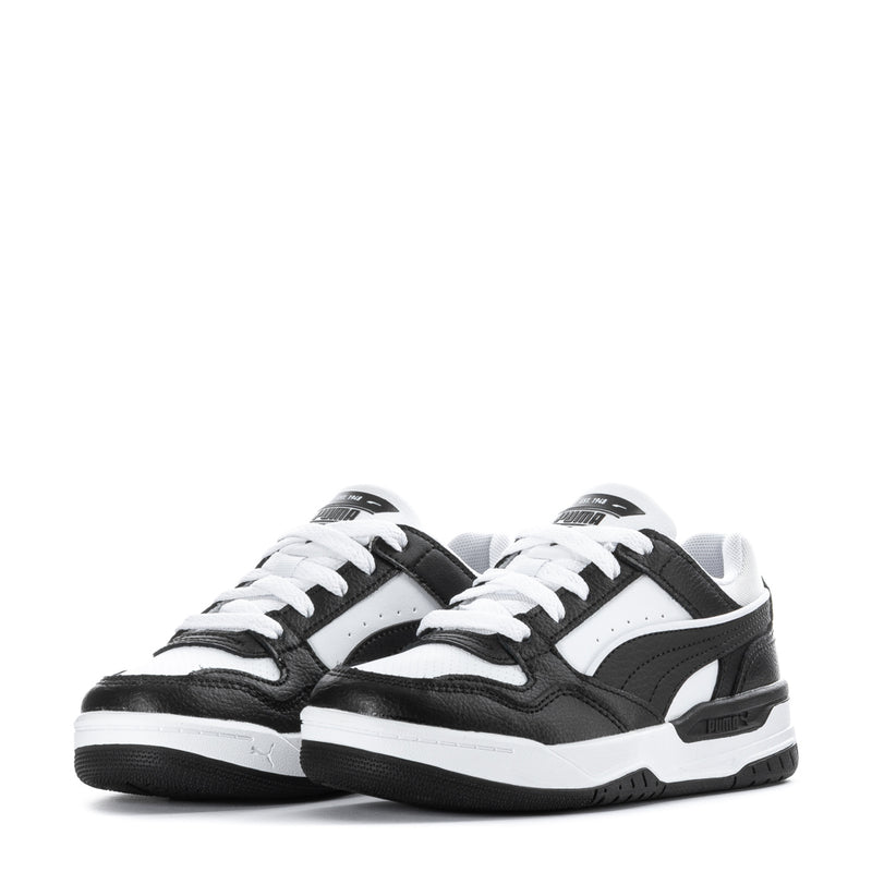 Kids low-top sneakers front view, black and white with Puma logos and white laces