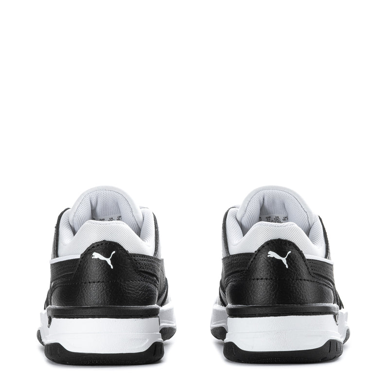 Kids low-top sneakers heel view, black uppers with white midsole and Puma branding