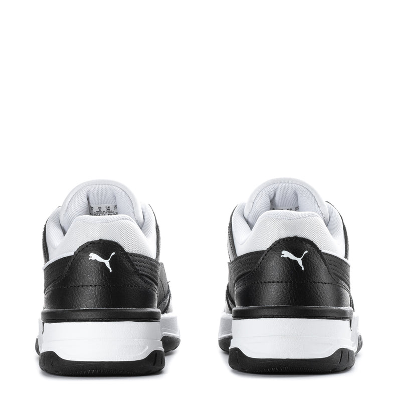 Youth sneakers back view, black uppers with white midsoles and Puma heel
