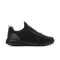 Black low-top lace-up knit sneakers with ribbed sidewall sole, side profile view