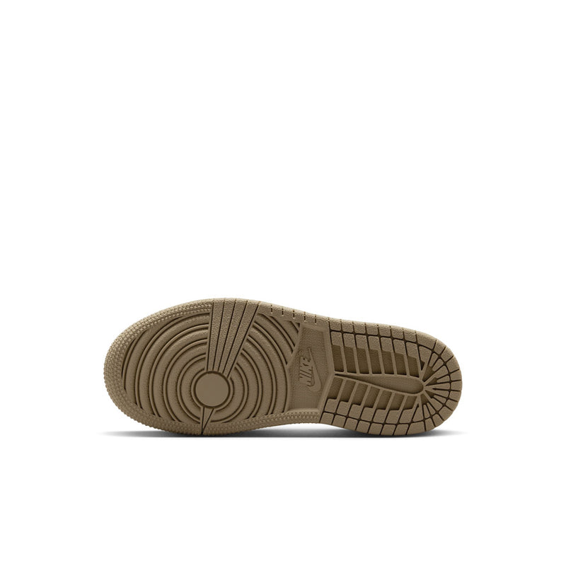 Kids high-top sneaker outsole view in tan rubber with circular traction pattern