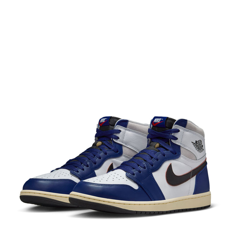 Pair of men's high-top sneakers with white leather, royal blue panels, and cream sole