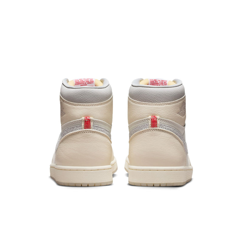 Men's cream high-top sneakers heel view, ankle pull tab, red stripe accent on back