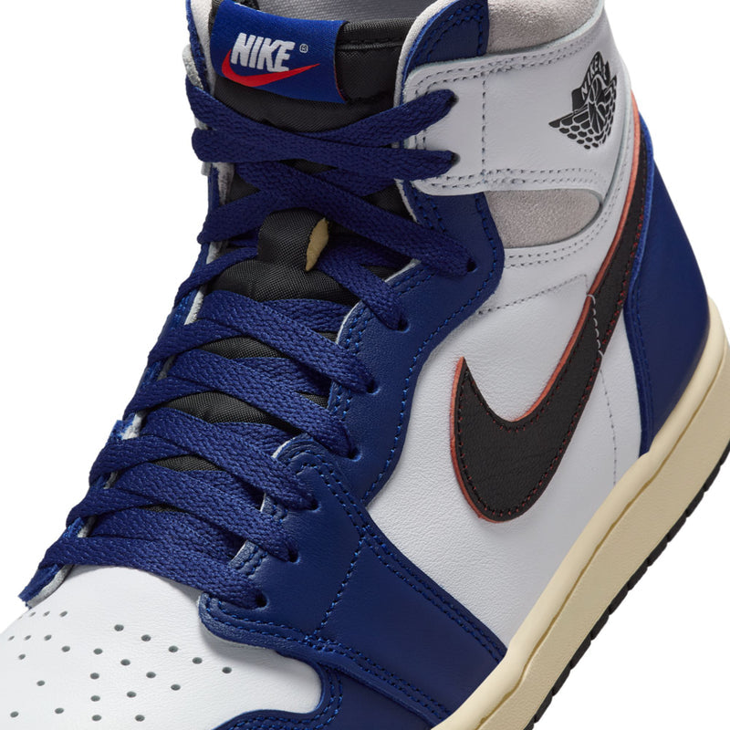 Men's high-top sneakers close-up: white leather, royal blue laces, black swoosh