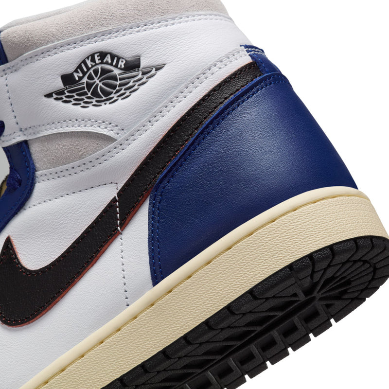 Close-up of men's high-top sneaker sole: cream edge, black tread, white and blue upper