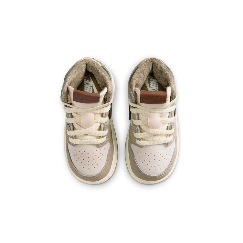 Toddler high-top sneakers viewed from above, showing cream laces and perforations