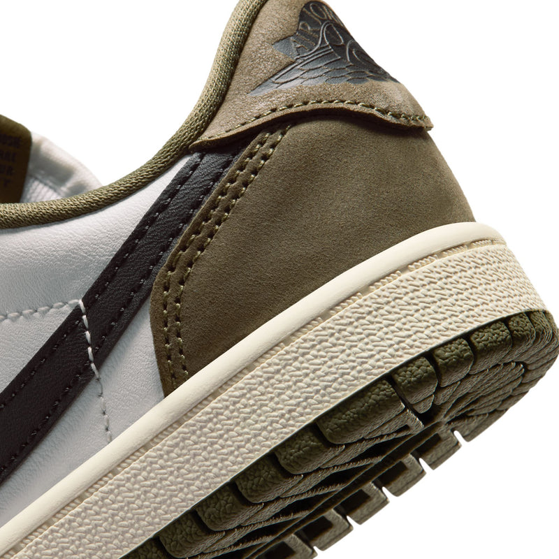 Kids sneaker close-up of heel and textured outsole with olive suede and black trim